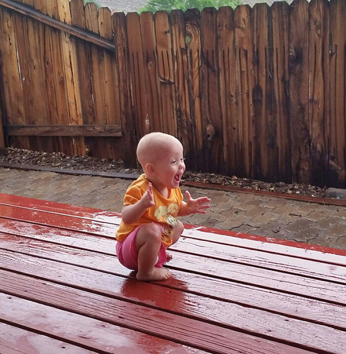 My Daughter Playing In/Seeing Rain For The First Time Yesterday